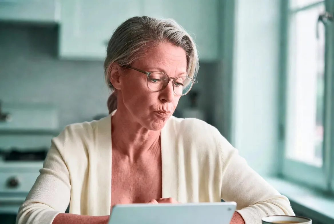 Woman researching how to choose a bladder probiotic with named Lactobacillus strains